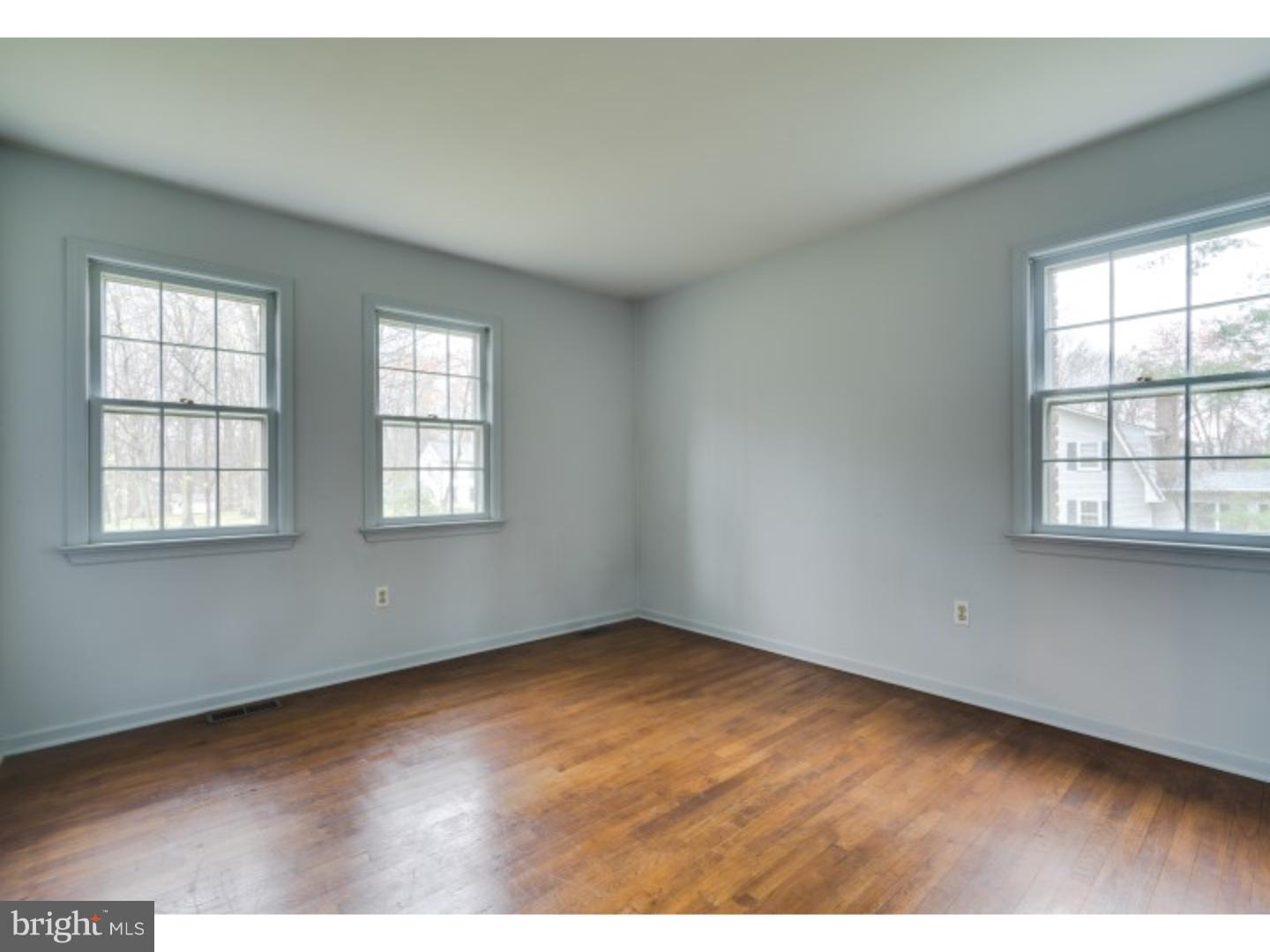 20 Sunset Road Lawrence Township, NJ 08648 - Photo 13 of 25 an empty room with wooden floor and windows
