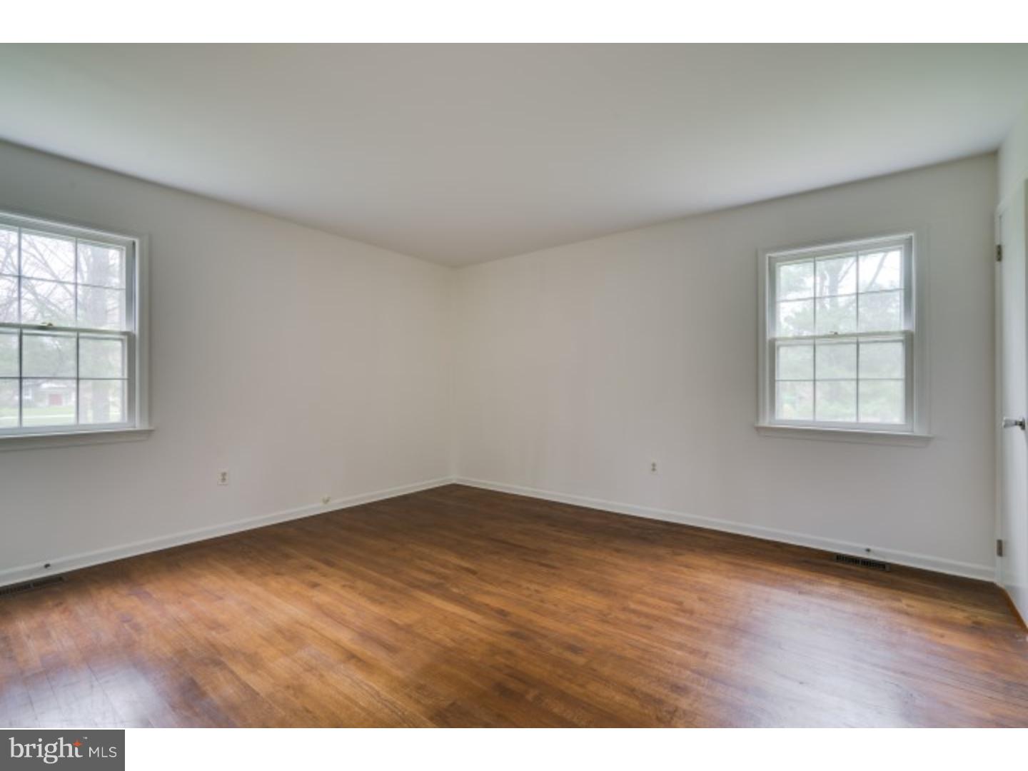 20 Sunset Road Lawrence Township, NJ 08648 - Photo 14 of 25 an empty room with wooden floor and windows