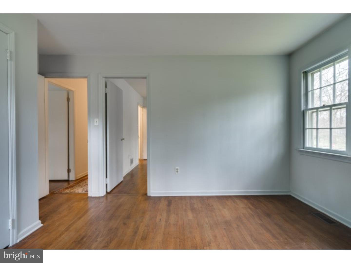20 Sunset Road Lawrence Township, NJ 08648 - Photo 16 of 25 a view of an empty room with wooden floor and a window