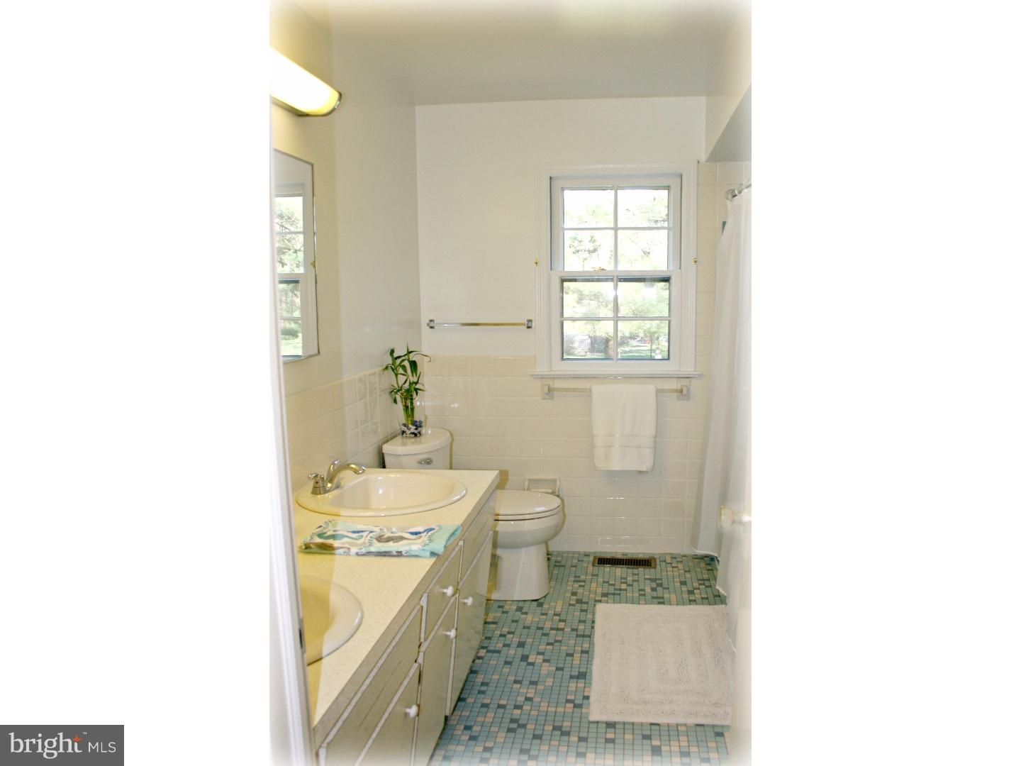 20 Sunset Road Lawrence Township, NJ 08648 - Photo 17 of 25 a bathroom with a sink toilet and shower