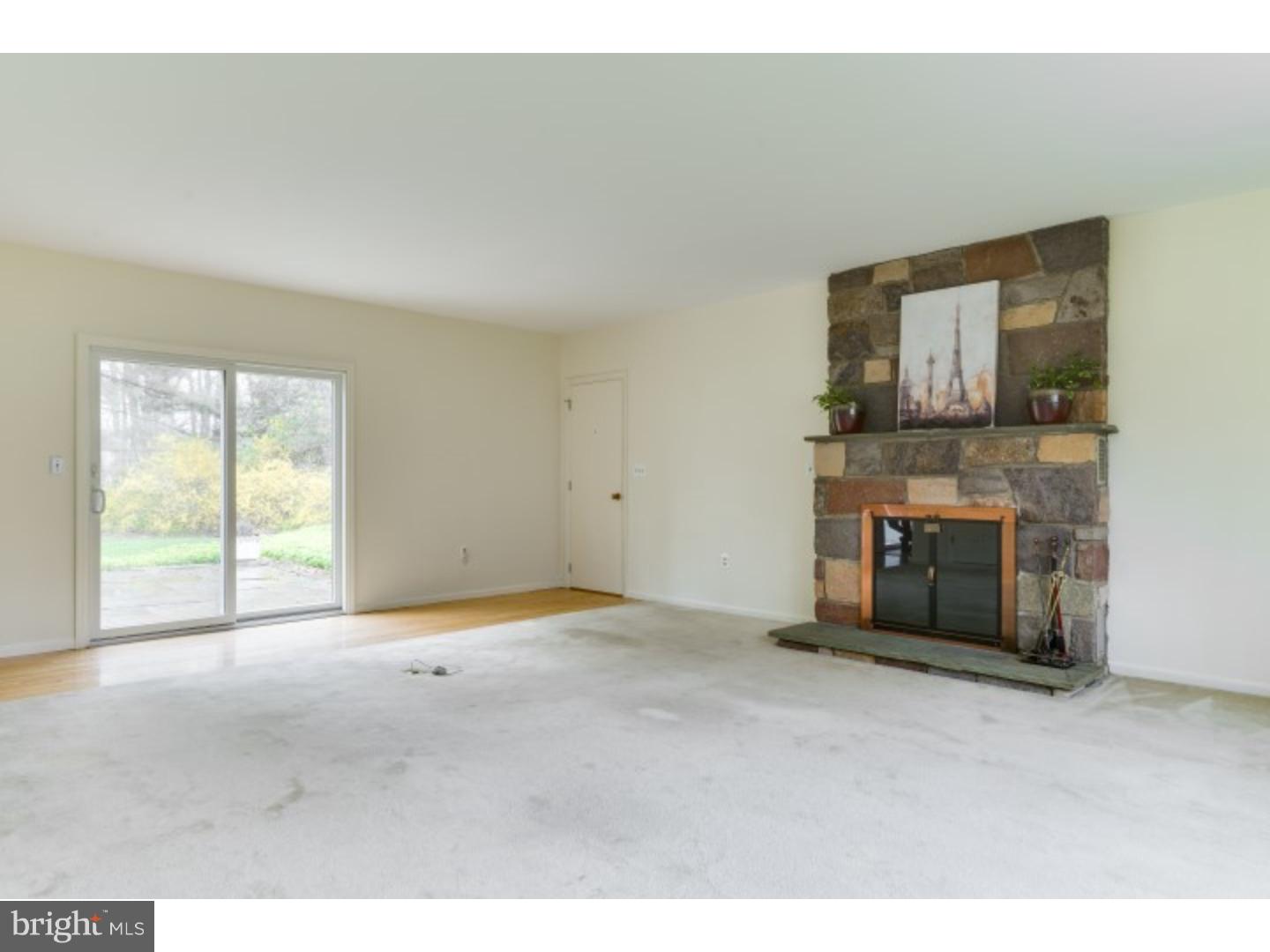 20 Sunset Road Lawrence Township, NJ 08648 - Photo 9 of 25 a view of an empty room with a fireplace and a window
