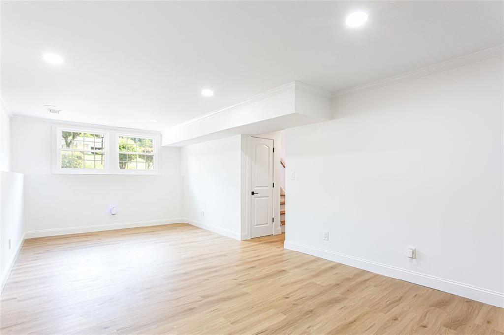 2814 Goodfellows Road Tucker, GA 30084 - Photo 31 of 46 an empty room with wooden floor and windows