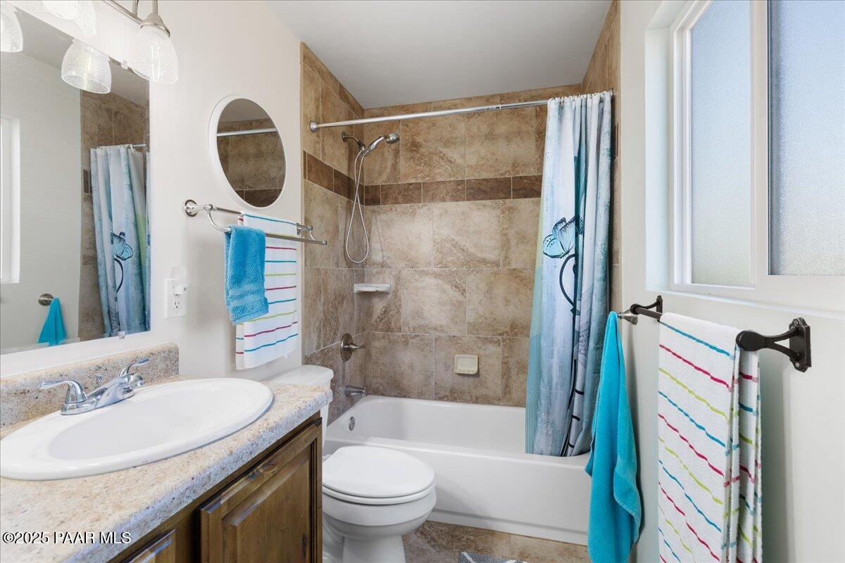 470 South Dewey Road Dewey-Humboldt, AZ 86327 - Photo 14 of 29 a bathroom with a granite countertop sink toilet and shower