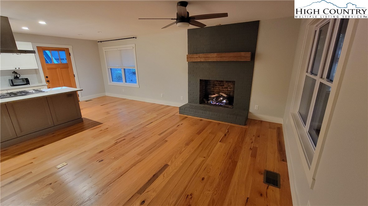 526 Hidden Valley Circle Boone, NC 28607 - Photo 2 of 29 a view of a kitchen with furniture and a fireplace