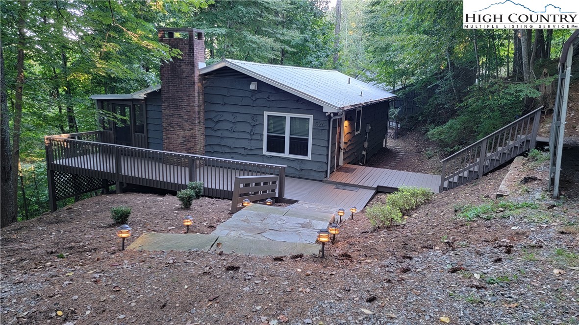 526 Hidden Valley Circle Boone, NC 28607 - Photo 29 of 29 a view of a house with backyard and sitting area