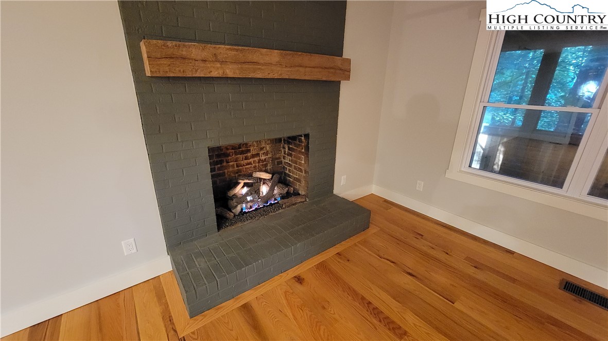 526 Hidden Valley Circle Boone, NC 28607 - Photo 3 of 29 a living room with a fireplace