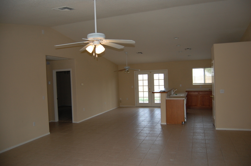 2408 East Cactus Road Phoenix, AZ 85032 - Photo 2 of 4 a view of a livingroom with furniture chandelier fan and fire place