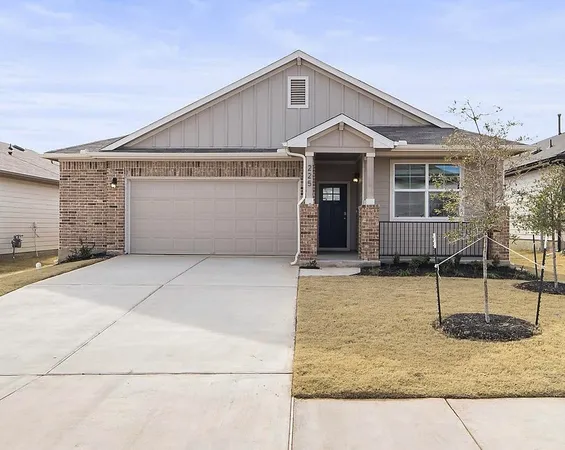 a view of house with backyard