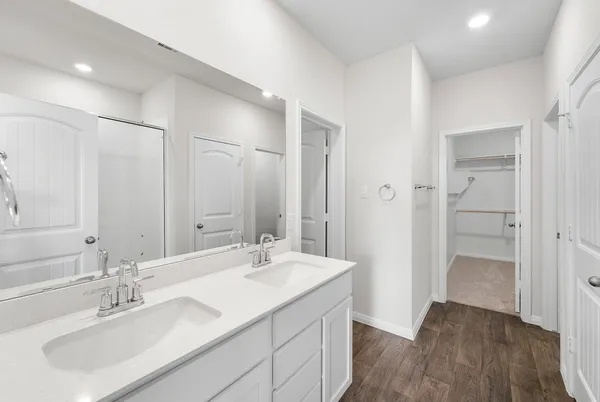 a bathroom with a sink double vanity and a mirror
