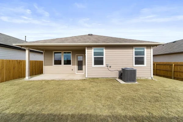 a house that has a big yard in front of it