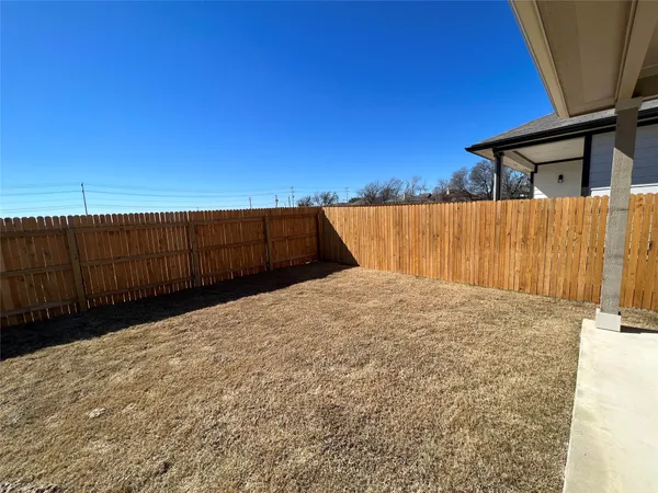a view of balcony with wooden fence
