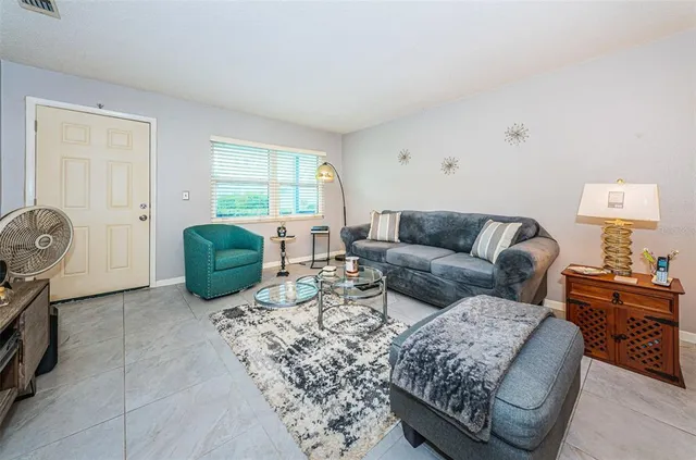 a living room with furniture and a window