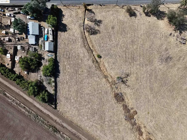 a view of water heater and wooden floor in a bathroom