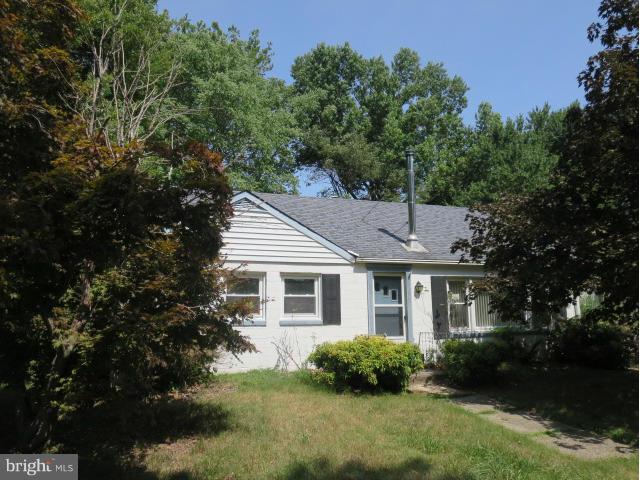 1616 Walnut Road St. Leonard, MD 20685 - Photo 1 of 11 a front view of a house with a garden and plants