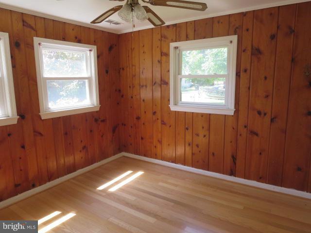 1616 Walnut Road St. Leonard, MD 20685 - Photo 7 of 11 an empty room with windows