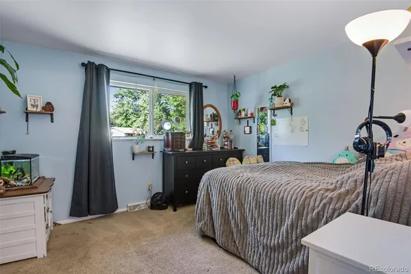 a bedroom with a bed and a table