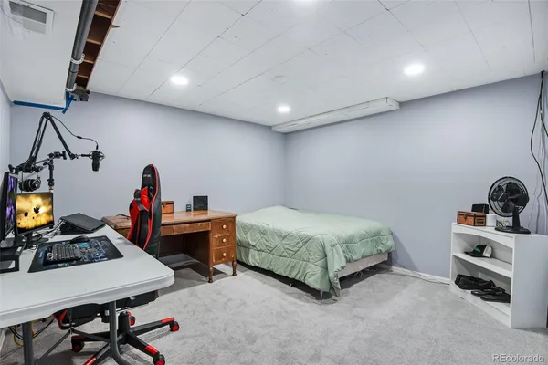 a room with a bed and a desk