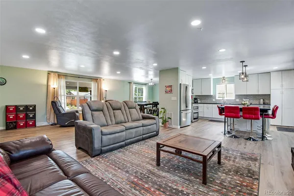 a living room with furniture and a table