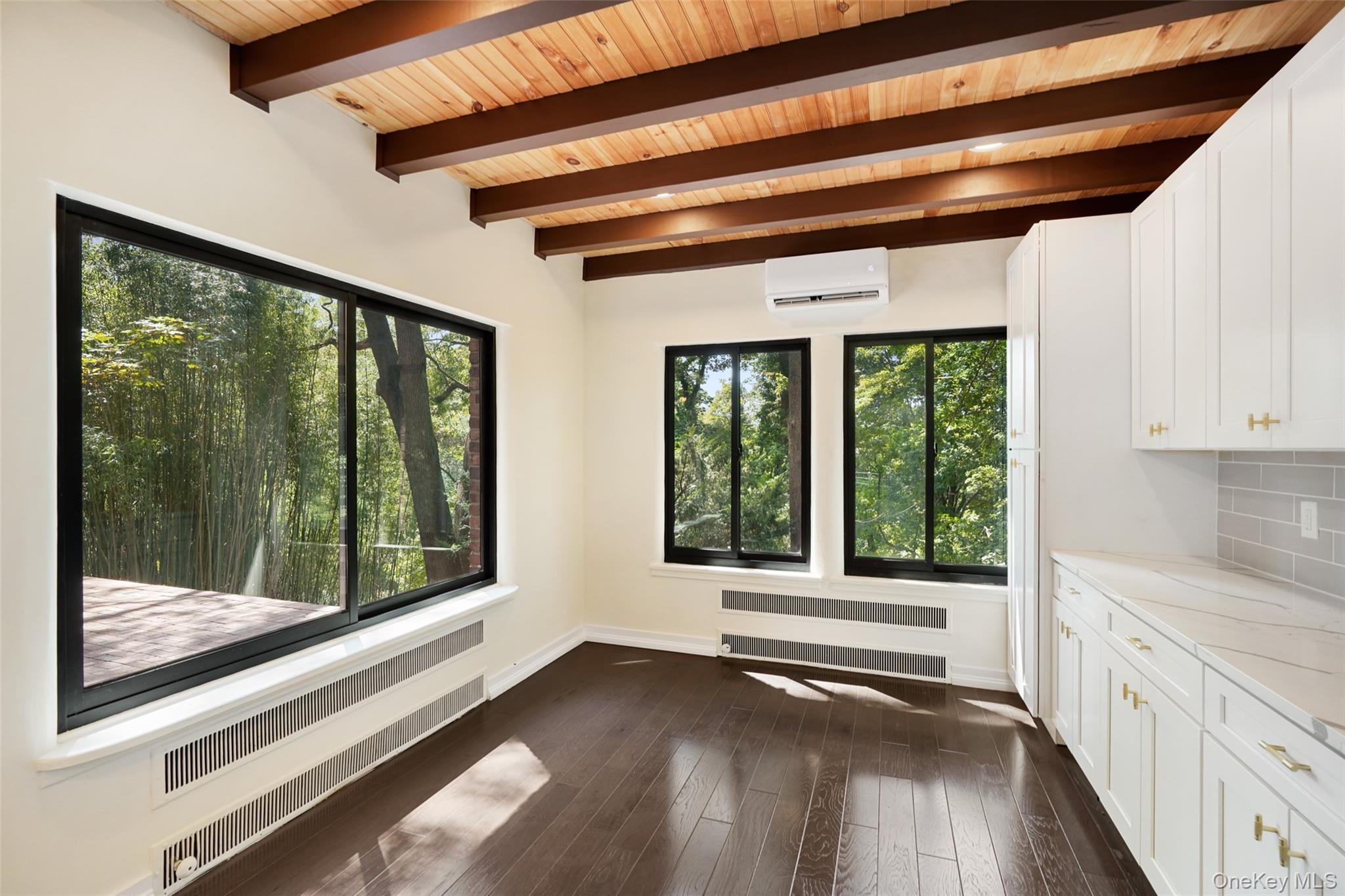 27 Hardscrabble Road Briarcliff Manor, NY 10510 - Photo 12 of 43 a view of a hardwood floor and a large window