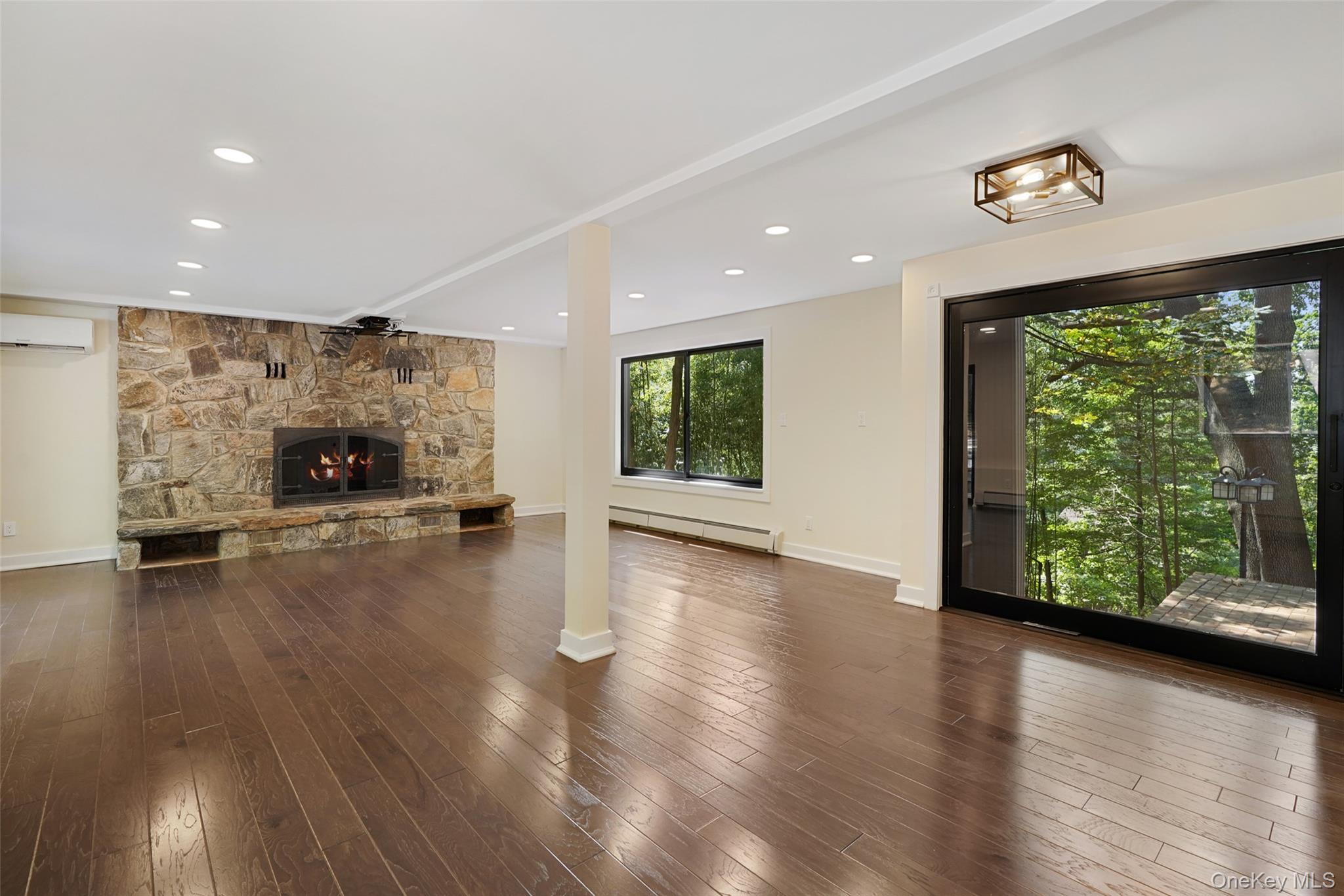 27 Hardscrabble Road Briarcliff Manor, NY 10510 - Photo 17 of 43 a view of empty room with wooden floor and fireplace
