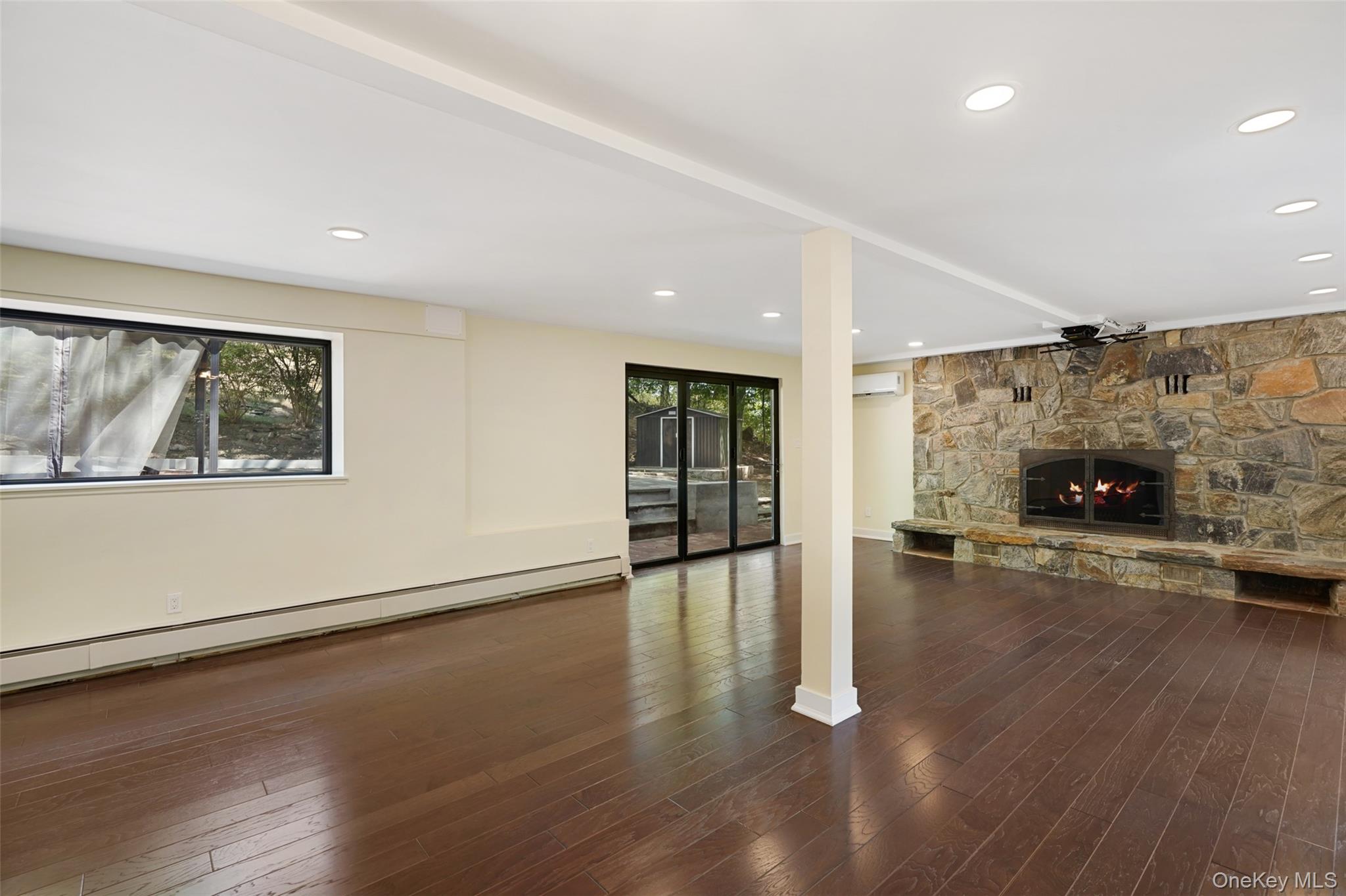 27 Hardscrabble Road Briarcliff Manor, NY 10510 - Photo 20 of 43 a view of empty room with wooden floor and fireplace