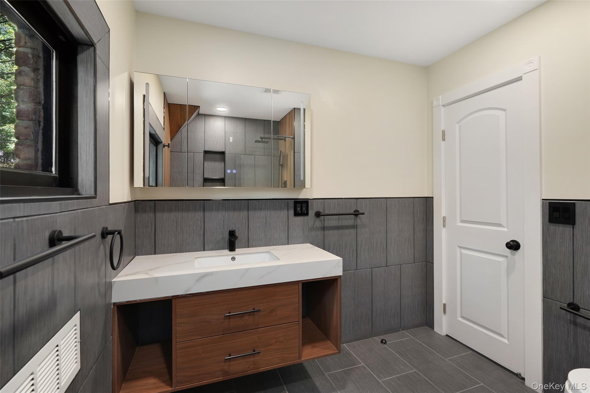 27 Hardscrabble Road Briarcliff Manor, NY 10510 - Photo 21 of 43 a bathroom with a sink and a mirror