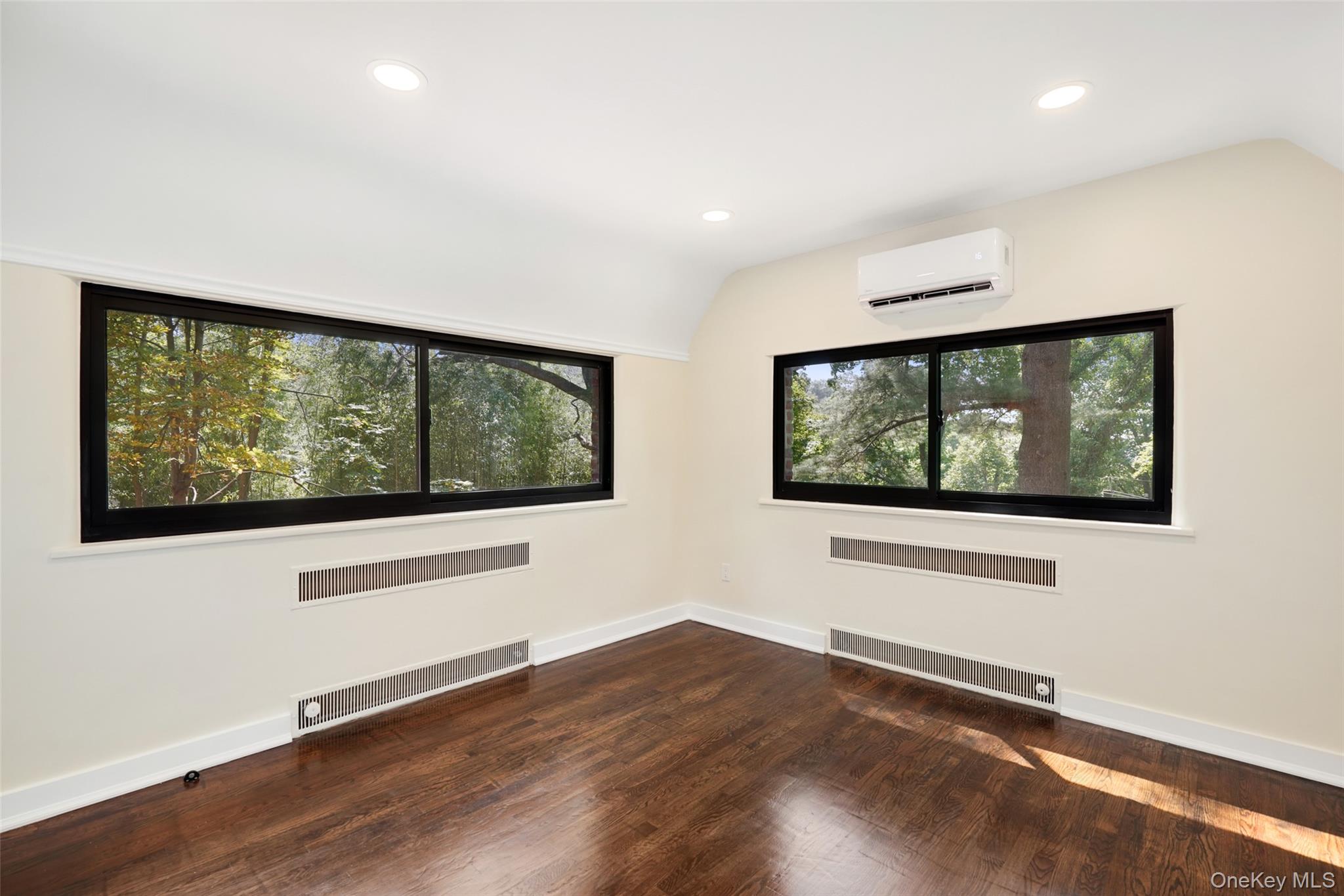27 Hardscrabble Road Briarcliff Manor, NY 10510 - Photo 23 of 43 a view of an empty room with wooden floor and windows