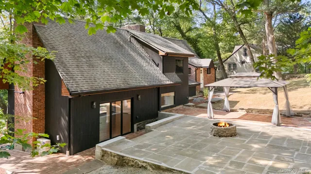 an aerial view of a house with outdoor space