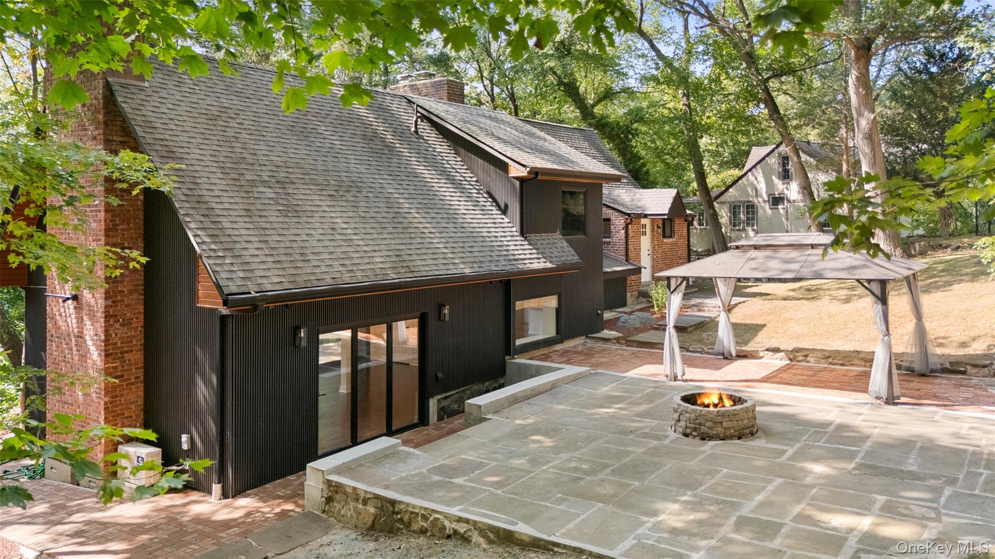 27 Hardscrabble Road Briarcliff Manor, NY 10510 - Photo 31 of 43 a backyard of a house with basket ball court