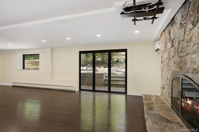 a backyard of a house with basket ball court