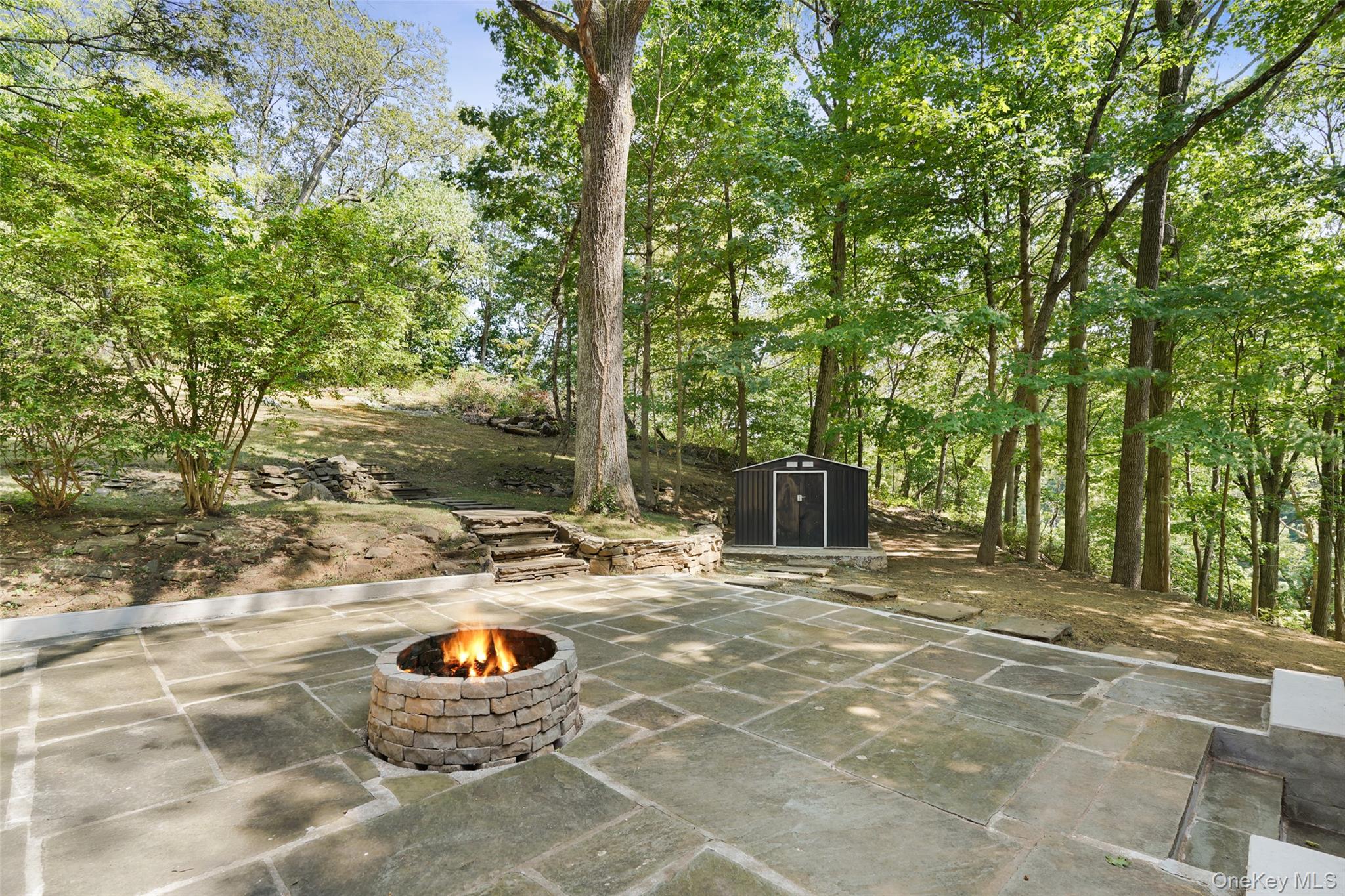 27 Hardscrabble Road Briarcliff Manor, NY 10510 - Photo 34 of 43 a backyard of a house with barbeque oven