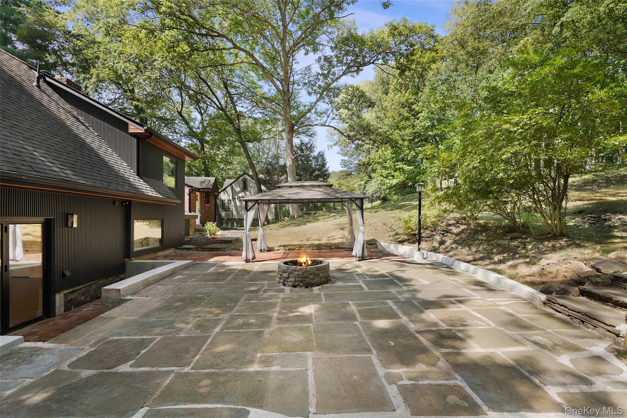 27 Hardscrabble Road Briarcliff Manor, NY 10510 - Photo 35 of 43 a view of a building with a bench