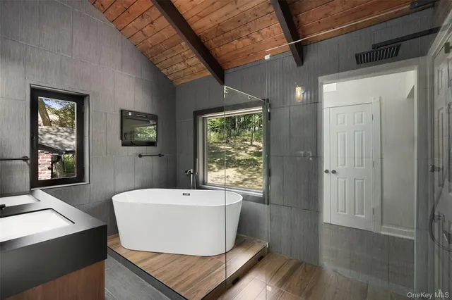 a view of a living room and a window with wooden floor