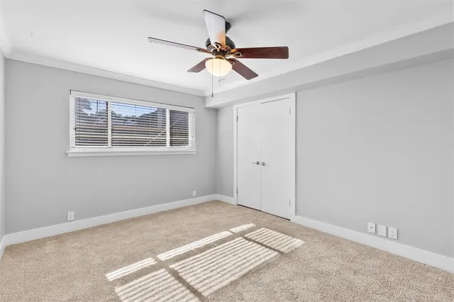 a bathroom with a granite countertop sink a toilet and a mirror