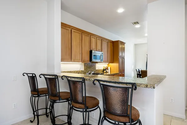 a view of a dining room with furniture and window