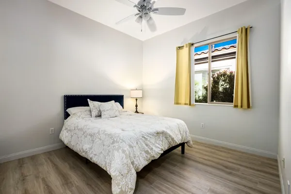 a bedroom with a bed and window