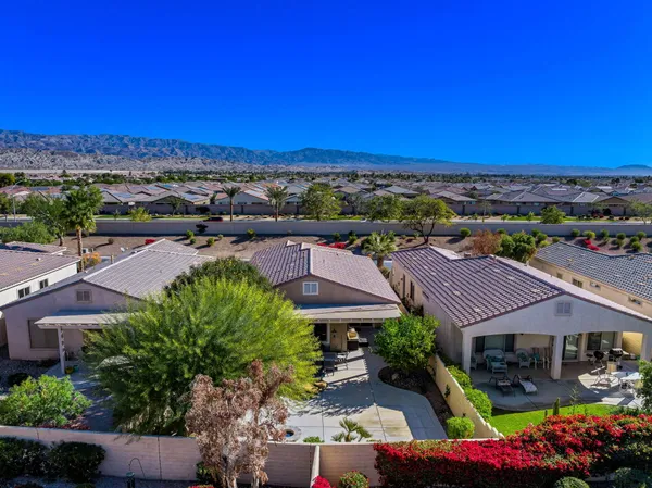 a view of houses with outdoor space and swimming pool