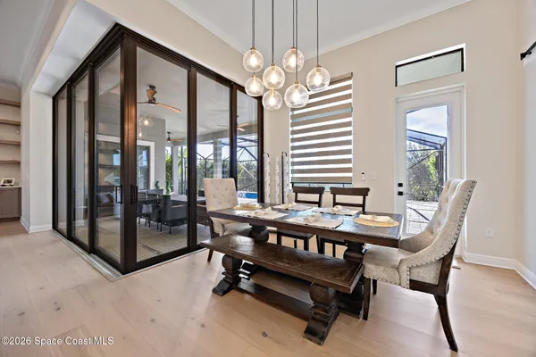 a large kitchen with stainless steel appliances lots of counter space and windows