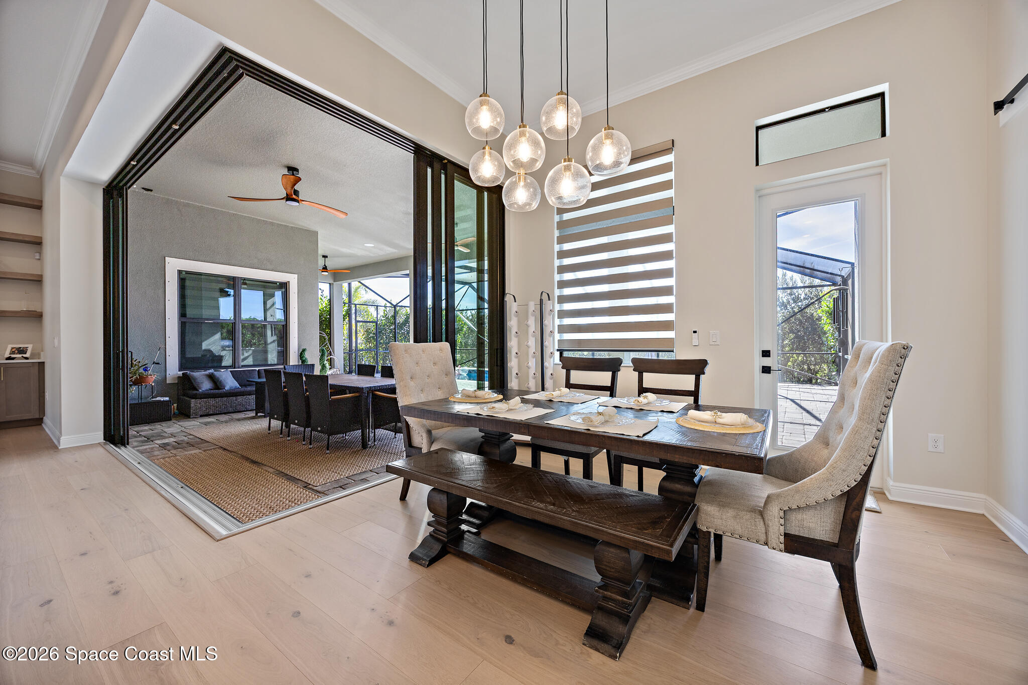 4055 Domain Court Melbourne, FL 32934 - Photo 15 of 49 a living room with furniture a chandelier and a window