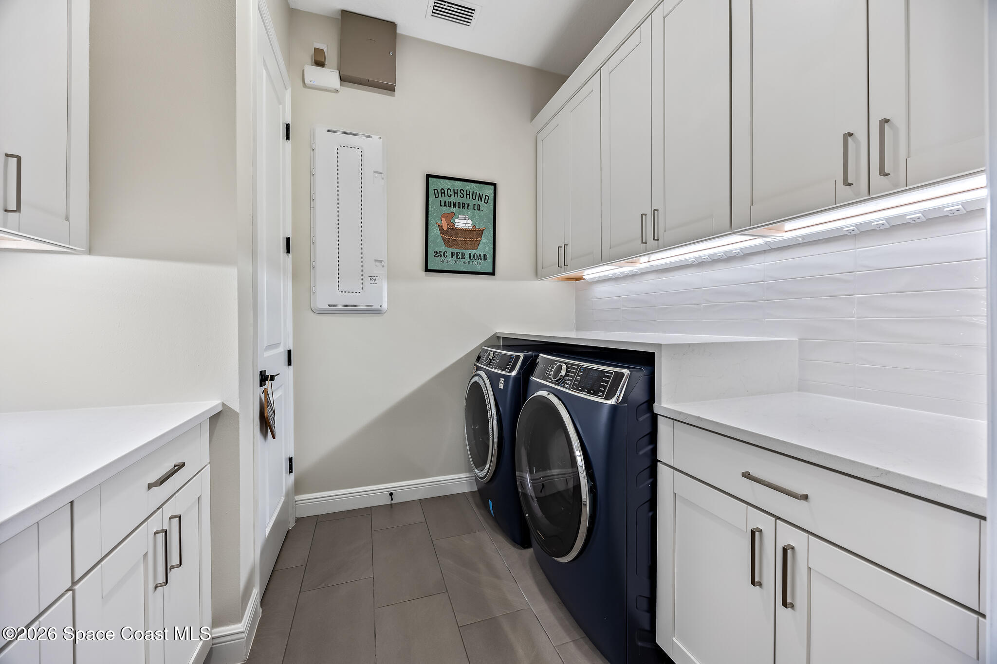 4055 Domain Court Melbourne, FL 32934 - Photo 20 of 49 a utility room with dryer and washer