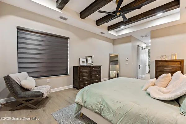 a bedroom with a large bed and furniture