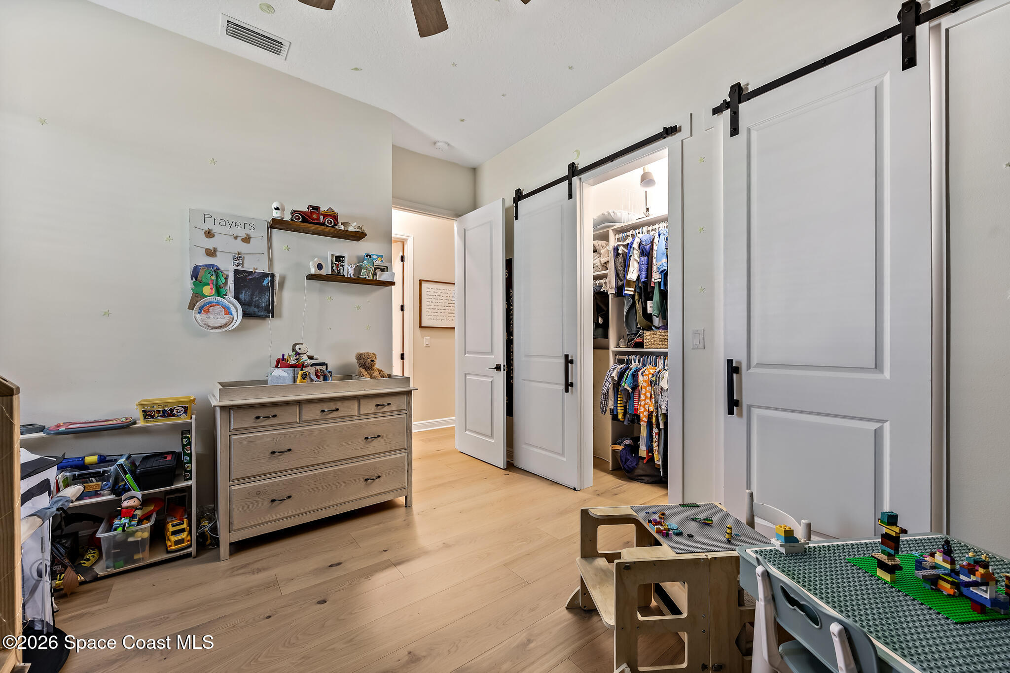4055 Domain Court Melbourne, FL 32934 - Photo 33 of 49 a view of walk in closet with clothes and shoes