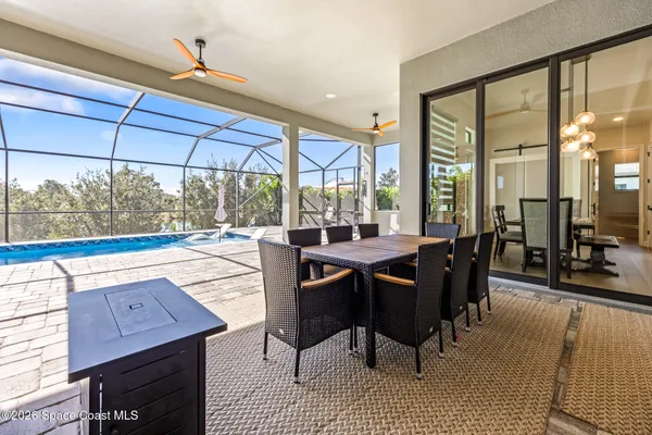 a view of a dining room with furniture window and outside view