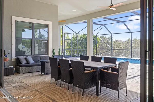 a view of a swimming pool with a patio