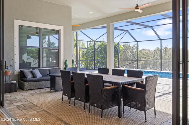 a view of a swimming pool with a patio