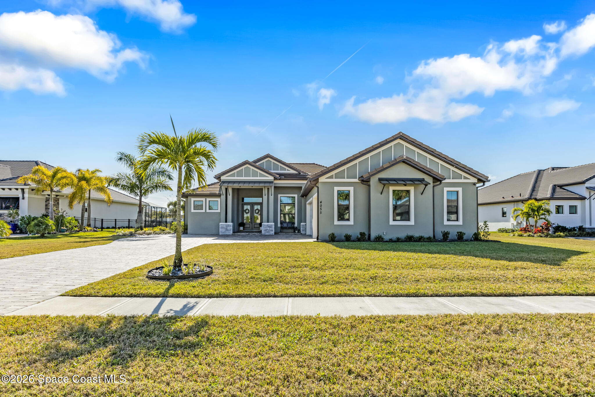 4055 Domain Court Melbourne, FL 32934 - Photo 48 of 49 a front view of a house with a yard