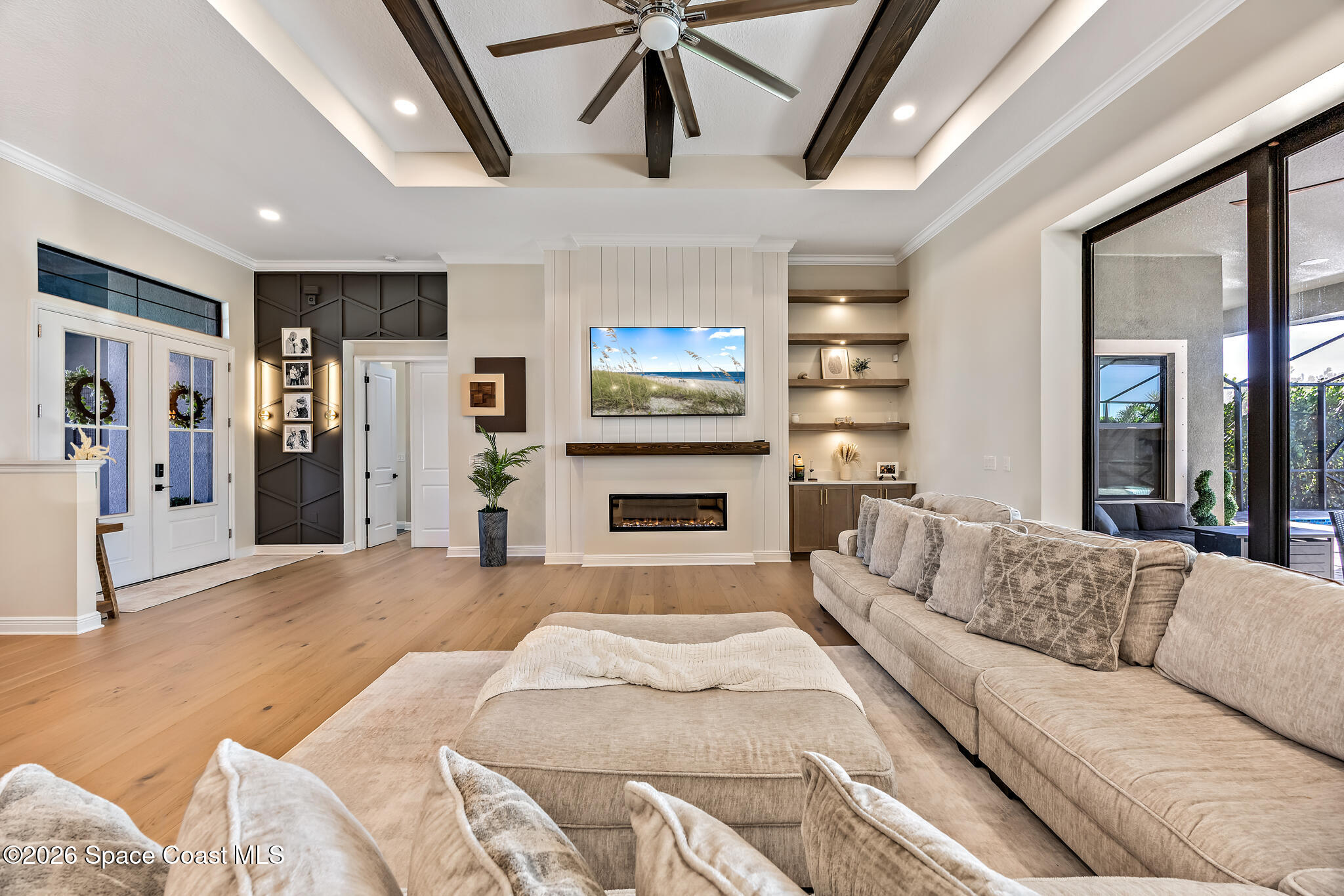 4055 Domain Court Melbourne, FL 32934 - Photo 9 of 49 a living room with furniture and a flat screen tv