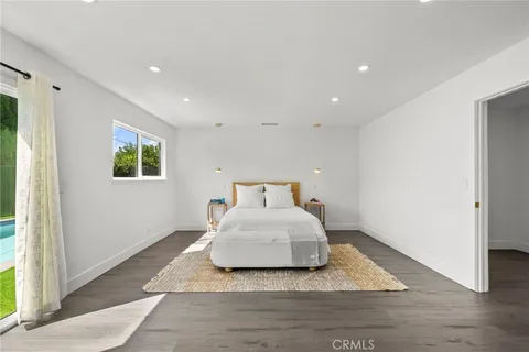 a room with a bed and a window