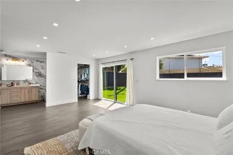 a view of a livingroom with furniture and a flat screen tv