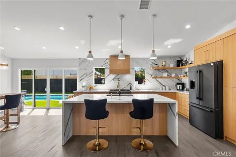 a kitchen with counter top space cabinets and stainless steel appliances
